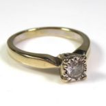 AN 18CT GOLD AND DIAMOND SOLITAIRE RING The single round cut diamond in a raised mount (size M/