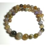 A 9CT GOLD AND AGATE BEAD NECKLACE The single row of graduating spherical agate beads with fluted