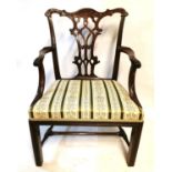 AN 18TH CENTURY MAHOGANY OPEN ARMCHAIR With carved top rail, pierced splat, swept arm and