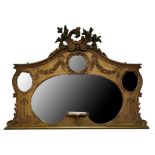 A VICTORIAN OVERMANTEL MIRROR The floral cartouche above three oval and one kidney shaped silvered