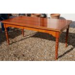 A FRENCH SOLID FRUITWOOD DRAW LEAF TABLE Raised on turned legs. (w 90cm x h 78cm x l 180cm, 360cm