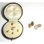 AN EARLY 20TH CENTURY 9CT GOLD OVAL CUFFLINKS With engine turned decoration, together with a cased