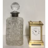A VINTAGE SILVER AND CUT LEAD CRYSTAL DECANTER Having a spherical stopper and star cuts to body,