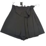 CHER MICHEL KLEIN, BLACK COTTON SKIRT With slight ruffled waistline, pleated side, black silk lining