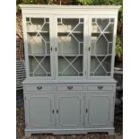 A REGENCY STYLE PAINTED BOOKCASE With three astragal glazed doors above drawers and cupboards 136