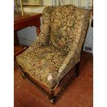 AN EARLY 20TH CENTURY EASY ARMCHAIR In tapestry upholstery, on barley twist supports. (63cm x 52cm x