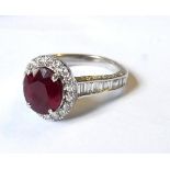 AN 18CT WHITE GOLD, RUBY AND DIAMOND RING Set with a 2ct oval ruby (1cm x 08cm) surrounded by