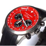 PORSCHE, A LIMITED EDITION STAINLESS STEEL AND TITANIUM GENT'S WRISTWATCH Red tone dial with three