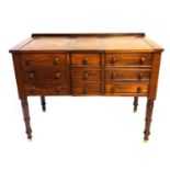 AN EARLY VICTORIAN MAHOGANY GENTLEMAN'S DRESSING CABINET With rise and fall tops, the centre