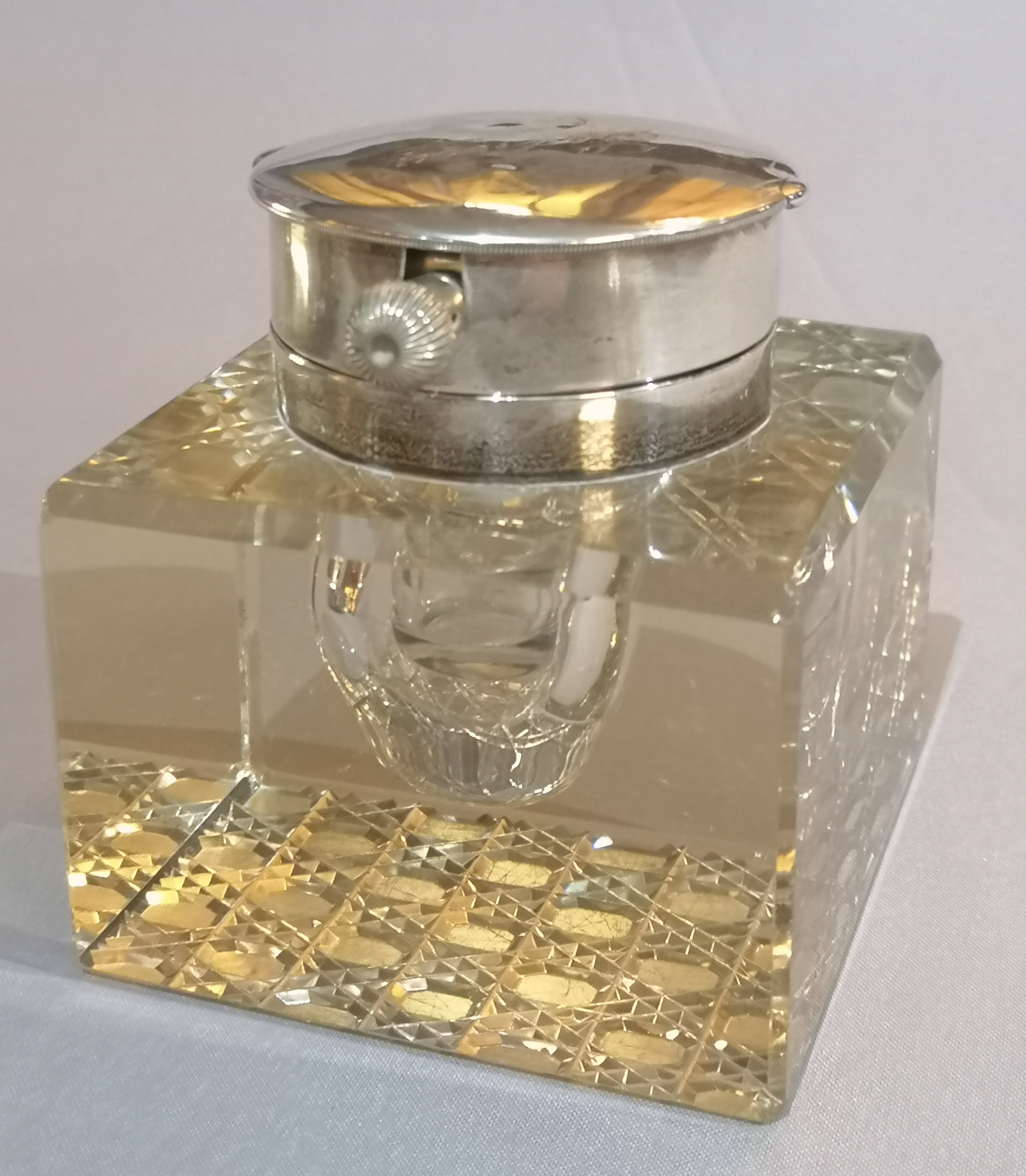 A RARE AND UNUSUAL EDWARDIAN SILVER AND CUT GLASS INKWELL/DESK CLOCK The hinged lid containing an