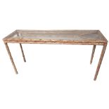 A 20TH CENTURY CONSOLE TABLE With inset glass top on organic base in a faux wash finish. (151cm x