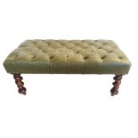 A VICTORIAN GREEN LEATHER BUTTON BACK STOOL Raised on mahogany barley twist legs on brass