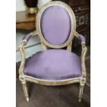 AN 18TH CENTURY FRENCH HEPPLEWHITE OPEN ARMCHAIR The cream and gilt spoon back frame delicately