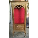 AN EARLY 20TH CENTURY CONTINENTAL GILTWOOD DISPLAY CABINET With single arched glazed door, adorned