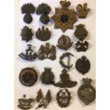 A COLLECTION OF TWENTY BRITISH ARMY BRASS BADGES Various regiments including military police,