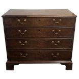 AN 18TH CENTURY STRAIGHT GRAINED WALNUT BACHELOR'S CHEST The fitted top drawer above three graduated