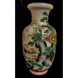 A CHINESE FAMILLE VERT PORCELAIN VASE Hand painted with an exotic landscape with yellow border to