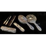 A 20TH CENTURY SILVER BRUSH AND COMB SET Comprising a hand mirror, two brushes and a tortoiseshell