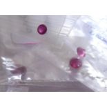 A COLLECTION OF LOOSE RUBIES Comprising a 6mm x 4mm oval cut, two 4mm round cut, a 3mm.