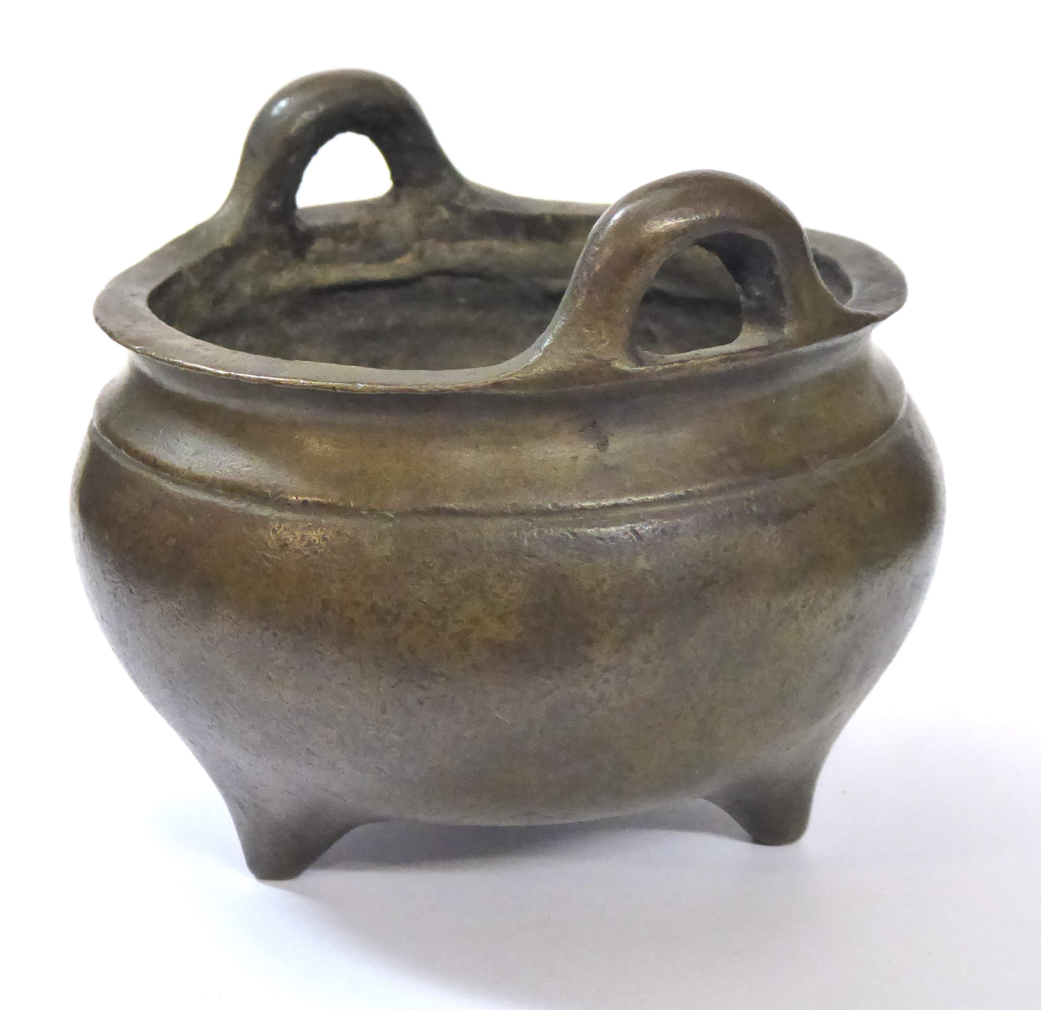 A CHINESE BRONZE CENSOR Spherical form on tripod feet. Bearing a six-character mark to base Approx