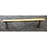 AN EARLY 20TH FRENCH FRUITWOOD BENCH. (22cm x 225cm x 40cm)