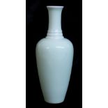 A CHINESE CELADON GLAZE BOTTLE VASE Having three consecutive rings to neck and Kangxi six-