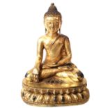 A LARGE CHINESE GILT BRONZE BUDDHA Seated pose on double lotus base