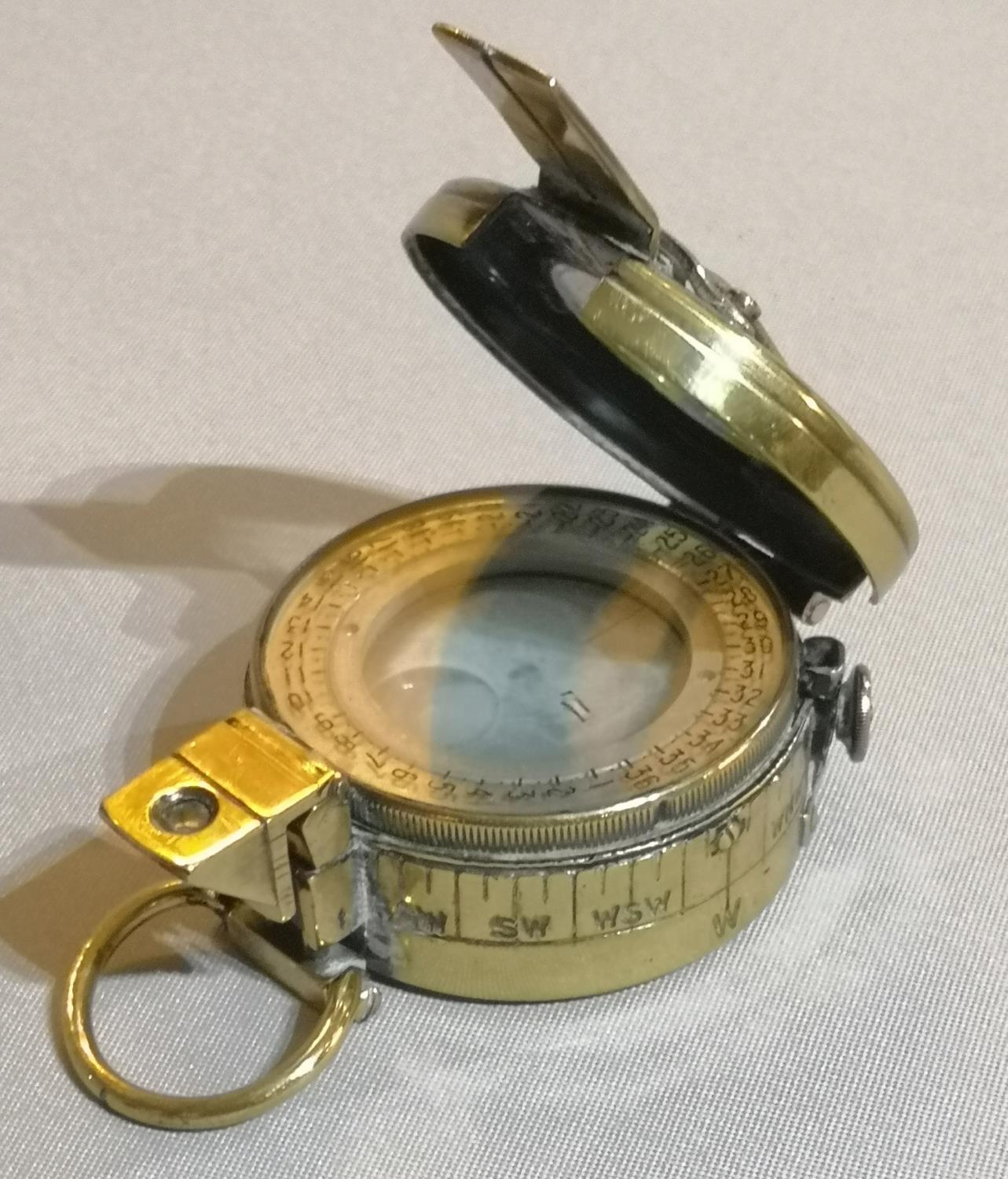 A WWI BRASS ARMY FIELD COMPASS Protective hinged cover, marked ODD No AA745, 1918 MK3A1. (approx - Image 2 of 2