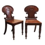 A PAIR OF REGENCY PERIOD MAHOGANY HALL CHAIRS. (39cm x 41cm x 81cm)