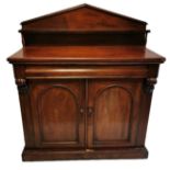 A VICTORIAN MAHOGANY CHIFFONIER With pointed arched gallery above cushion drawer and cupboards. (