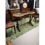 A HIGH VICTORIAN WALNUT KIDNEY SHAPED LADIES WRITING TABLE With green tooled leather top above a