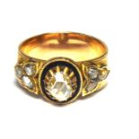 AN 19TH CENTURY YELLOW METAL, DIAMOND AND ENAMEL BAND RING The single oval mine cut diamond,edged in