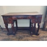 AN EARLY VICTORIAN MAHOGANY LADIES DRESSING TABLE With inverted bow front fitted with five