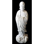 A CHINESE BLANC DE CHINE PORCELAIN FIGURE OF A SAGE/LOHAN Standing on stylised waves with long