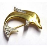 A VINTAGE 9CT GOLD BI COLOUR DOLPHIN BROOCH Geometric form with white gold decoration. (approx 3.