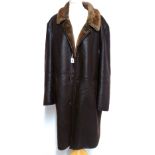 A VINTAGE LEATHER AND SHEEPSKIN GENT'S COAT Brown leather with interior pockets (size 54).