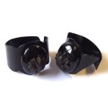 A PAIR OF VICTORIAN JET AND CELLULOID MOURNING CUFFS The celluloid cuffs having jet lockets to front
