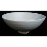 A CHINESE YUAN DYNASTY LONGQUAN CELADON GLAZED POTTERY BOWL Of conical form of plain design. Bearing