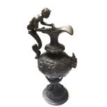 A 19TH CENTURY BRONZE GRAND TOUR FORM EWER Having a figural handle with rams head and embossed