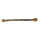 AN ANTIQUE TRIBAL ART CEREMONIAL CLUB/STICK Having exotic wood twisted scroll body and bronzed