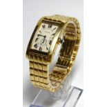 A GENTLEMAN'S 18CT GOLD CARTIER TANK BRACELET WATCH Boxed with papers.