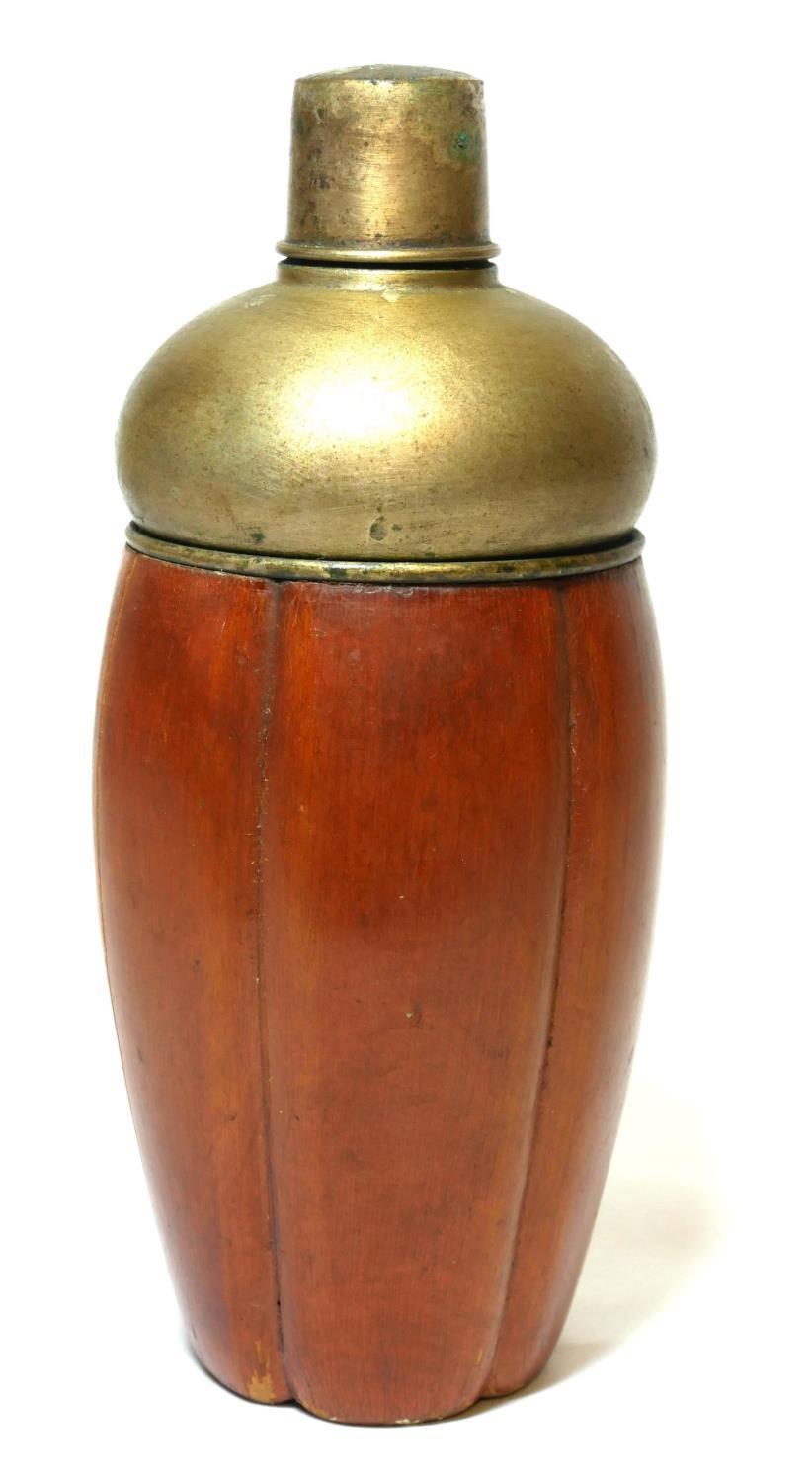 A VINTAGE WHITE METAL AND FRUITWOOD CLAD COCKTAIL SHAKER. (24cm)