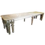 AN 18TH CENTURY AND LATER SILVERED GILTWOOD DINING TABLE With three section onyx top raised on