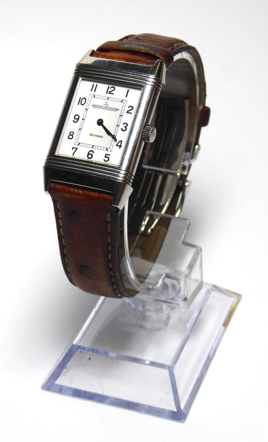 JAGUER LE COULTRE, A GENTLEMAN'S STAINLESS STEEL REVERSO WATCH On tan leather strap, boxed with