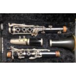 AN EARLY 20TH CENTURY VINTAGE BOOSEY & HAWKES EBONISED SIX KEY CLARINET In original black velvet