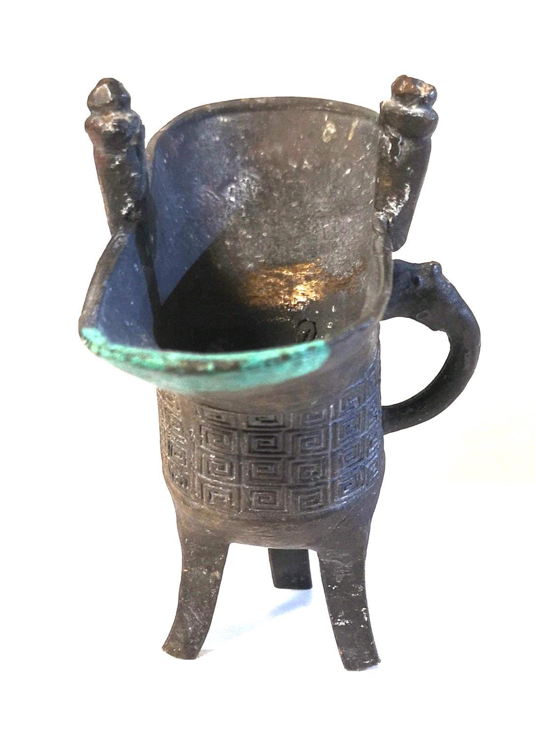 A CHINESE ARCHAIC FORM BRONZE OVAL EWER With geometric decoration and tripod legs, bearing a ' - Image 2 of 2