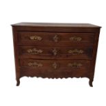 AN 18TH CENTURY FRENCH SOLID OAK SERPENTINE FRONTED CHEST Of two short above two long drawers fitted