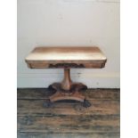 A WILLIAM IV BLEACHED ROSEWOOD FOLD OVER CARD TABLE With red circular playing surface raise on a