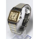 CARTIER, SANTOS, A GENTLEMAN'S TWO TONE BRACELET WATCH Boxed.