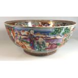 AN 18TH CENTURY CHINESE FAMILLE ROSE PORCELAIN BOWL Decorated with gilt scrolls, flowers and